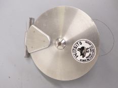 Brushed aluminium centrepin fishing reel in soft cloth bag