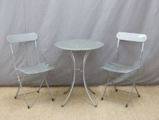 A garden table and two chairs