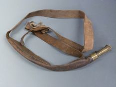 Sykes leather and brass shot flask with shoulder sling, 40cm long.