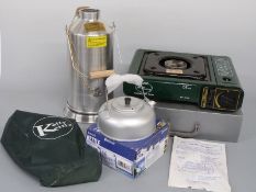 A stainless steel Kelly Kettle together with a Euro Technology portable gas stove and an Outwell