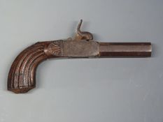 Percussion hammer action pocket pistol with engraved lock, carved grip, pointed butt and 2.