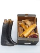 A pair of vintage riding boots with trees and five further pairs of boot trees