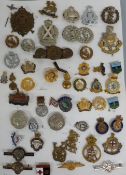 Fifty-two military and other badges including sweetheart examples, TA, ICDS, Sussex, Lovat Scouts,