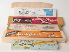 Five Keil Kraft and other wooden model kits comprising Aerokits Sea Nymph boat, Ladybird, Minimoa,