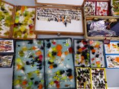 Nine fly fishing boxes with flies, mostly lures and wet, good selection of sea trout/salmon trebles,