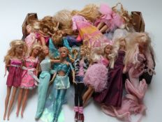 Approximately thirty Barbie dolls of differing ages