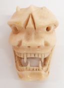 Japanese netsuke depicting an Oni mask