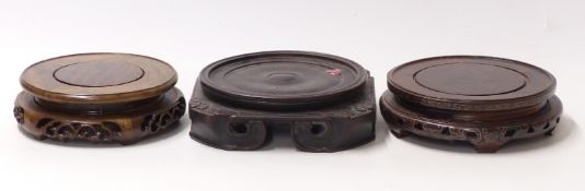 Three 19thC Chinese carved hardwood stands for vases / jardinieres,