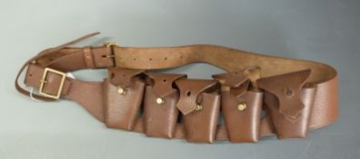 A brown leather ammunition belt with five separate compartments