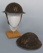Two WWII British warden's helmets,