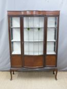Early glazed bow fronted cabinet raised on cabriole legs,