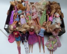 Approximately thirty Barbie dolls of differing ages