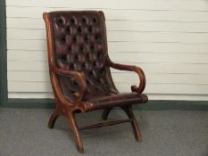 A leather Chesterfield saloon chair
