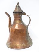 A 19th / 20thC Eastern / Islamic copper tea / coffee pot with hinged lid and chequered handle