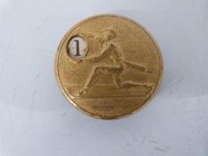 A circular vintage game counter decorated with a baseball pitcher, numbered 1-9,