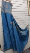 Oriental silk hooded cape with embroidered gilt decoration on a blue ground