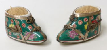 A pair of Chinese white metal mounted ceramic shoes