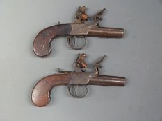 A pair of Howe of Colchester flintlock hammer action pocket pistols each with named and engraved