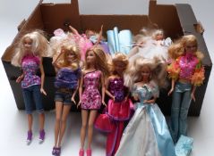 Approximately thirty Barbie dolls of differing ages