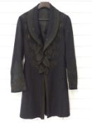 A British Army Victorian Cavalry officer's frock coat in black cloth with black braid to collar,