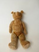 Blonde mohair straw filled Teddy bear with growler, disc joints, cocked feet and humped back,