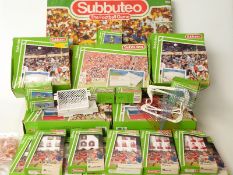 Twenty-three Subbuteo sets, teams and accessories including Italia 90 World Cup Edition,