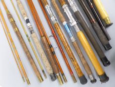 Eight vintage fishing rods including three heavy duty sea fishing boat rods,