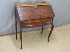 Continental bureau with galleried top raised on cabriole front legs,