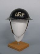 WWII ARP steel helmet complete with liner and chin strap