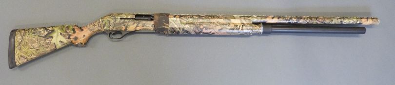 Escort Magnum 10 shot 12 bore semi-automatic shotgun with dipped camouflage paint finish,
