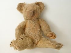 A vintage blonde mohair Teddy bear with disc joints,