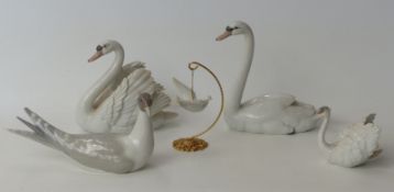 Three Lladro swan figures,