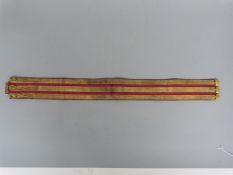 A c1820 16th Lancers stable belt/girdle, red Morocco leather with leather fastener strap,