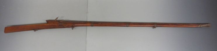 Afghan matchlock gun of crude construction with sling suspension mounts, four brass barrel bands,
