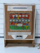 A vintage 'Top Ten' penny in the slot coin operated machine with decals for Adam Faith,
