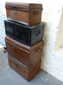 Four vintage metal or metal bound trunks,