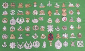 A display of 66 military cap badges to include Scottish and Irish regiments, Lancashire,