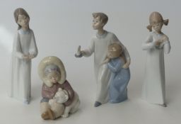 Four Lladro child figures including an Eskimo / Inuit figure with polar bear cub