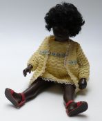 Sasha black doll with pink lips, blue eyeshadow, black hair,