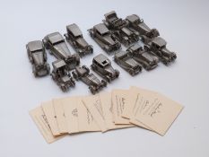 Twelve Danbury Mint pewter model cars with information cards
