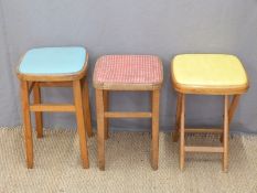Three retro kitchen stools and two rush seated examples
