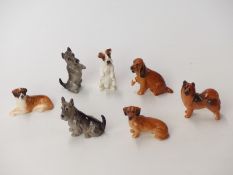 Seven Royal Doulton dog figures from the K series including K15 Chow and K19 St Bernard