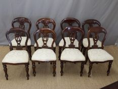 Extending dining table with two extra leaves together with a set of dining chairs with reeded