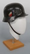 WWII Luftwaffe M40 double decal helmet with eagle carrying swastika to one side and crest to other,