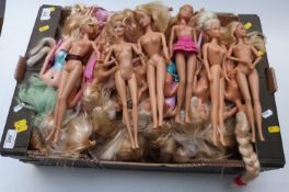 Approximately seventy Barbie dolls