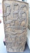 A tribal wooden door with bird and crocodile decoration,