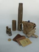 WWI enamel water flask in original webbing carrier, two shell cases, military binoculars,