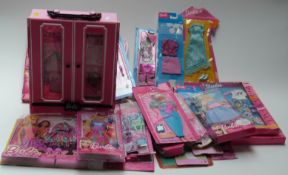 Collection of Barbie doll clothes and accessories in original packaging,