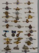 Thirty-five military sweetheart brooches including Gloucestershire, Berkshire, Scottish Rifles,