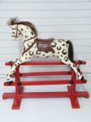 Lines Bros wooden dapple grey rocking horse on red base stamped LB Ltd SP1, 115cm long,